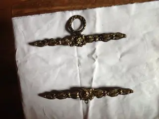 Koperen ornament voor schellenkoord