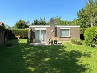 Genieten van dit knusse vakantiehuis met grote tuin in het bos