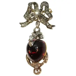 Symbolic Love: Victorian Garnet Heart with Diamond-Encrusted Bow Pendant