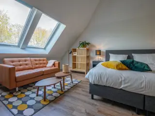 Heerlijke ruime suite met tuin op voormalige hooizolder