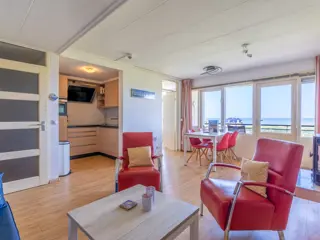 Huiselijk appartement met groot balkon vlakbij De Koog