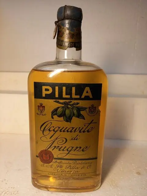 Pilla - Plum eau-de-vie - b. Jaren 1930 - 1,0 Liter