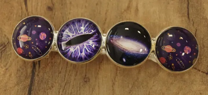 Haarclip cabochon " Planeten, zwart gat en oog "