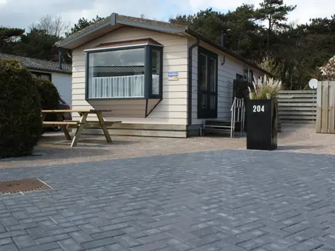 Sfeervol chalet met tuin vlakbij het strand aan de rand van De Koog