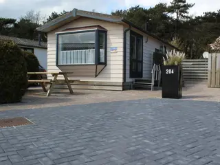Sfeervol chalet met tuin vlakbij het strand aan de rand van De Koog