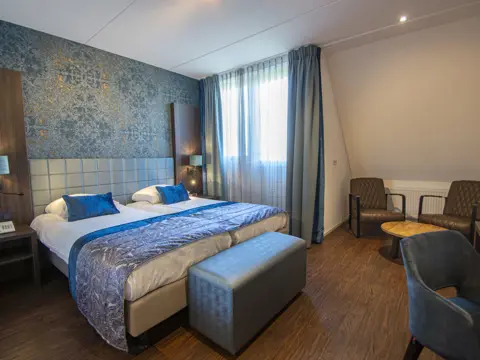 DeLuxe kamer met balkon op vijf fietsminuten van het strand