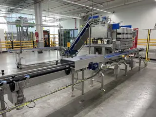 Newtec PCS2009 afweeglijn voor product in schaaltjes met flowpackmachine