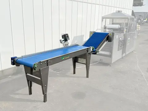 Christiaens invoerband met elevator voor kommkommersealer