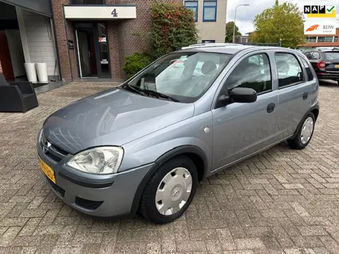 Opel Corsa 1.2-16V Essentia, bj.2003,grijs,5 deurs,airco,APK tot 10/2026 en NAP met 221140 km.stuurb