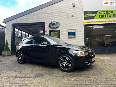 BMW 1-serie 114i Business+ Sport Zwart 2012 Schuifdak