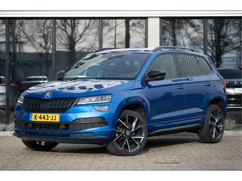 Škoda Karoq 1.5 TSI ACT Sportline Business | Trekhaak | Adapt. Cruise | CANTON | Camera | 19" | Wint