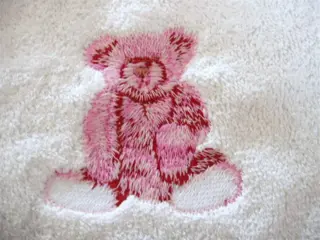 Slabbetjes geborduurd met motief en tekst of naam