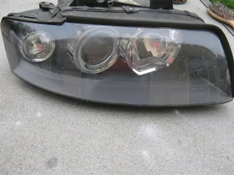 AUDI A4 bi-xenonkoplamp/linksachterportier