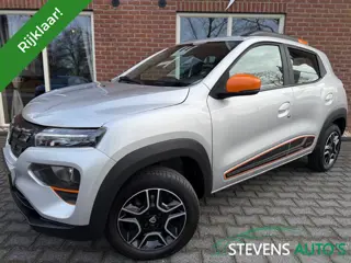 Dacia Spring Comfort+ (Orange p.) NAVI / LEER / CAMERA/ AIRCO / CRUISE / CARP