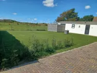 Chalet op loopafstand van het strand met uitzicht op de duinen en de vuurtoren