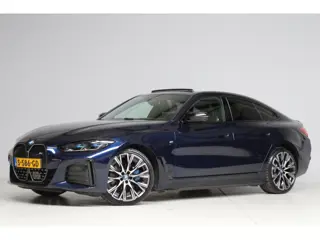 BMW I4 M50 M-sport | schuifkanteldak | adap. cruise | head-up | 360 camera | harmankardon | elek. tr