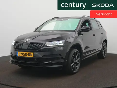 Skoda Karoq 1.5 TSI ACT Sportline Business DSG / Elek. Trekhaak / Camera / Canton-Audio