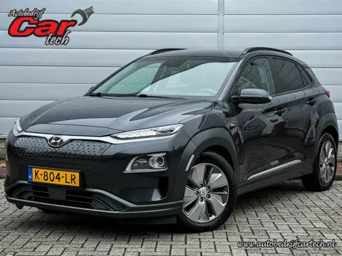 Hyundai KONA EV Premium 64 kWh | Clima | Cruise | Navi | Led | Leer | Stoel/stuur verwarming | Pdc |