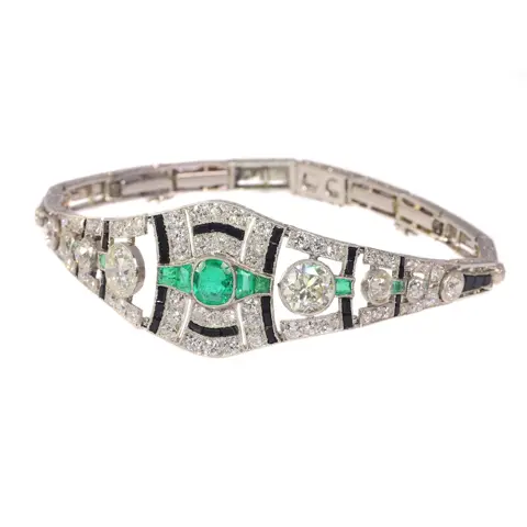 Sophisticated Art Deco Platinum Bracelet: Diamonds, Emeralds, and Onyx