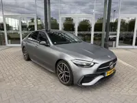 Mercedes-Benz C-klasse 180 AMG Line Night Pakket Magno Grey | panoramadak | laser led | elek. stoele
