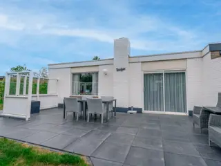 Fraaie bungalow met sfeerhaard in het bos nabij strand en De Koog