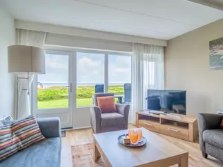 Appartement nabij De Koog met ruim zonnig terras met zeezicht