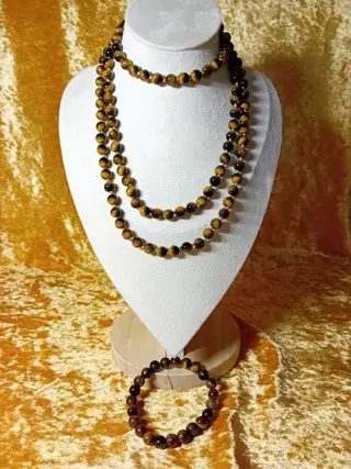 Mooie lange tijgeroogketting met rekbare armband.