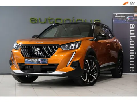 Peugeot 2008 1.2 PureTech GT *UNIEK 18dkm* Orange Metallic/Apple Carplay & Camera