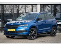 Škoda Karoq 1.5 TSI ACT Sportline Business | Trekhaak | Adapt. Cruise | CANTON | Camera | 19" | Wint