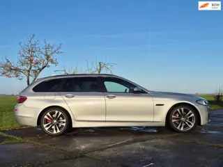 BMW 5-serie Touring 520i High Executive 19"/trekhaak/nivo reg.
