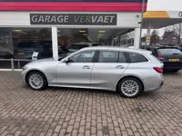 BMW 3 Serie Touring 330e High Executive (bj 2021)