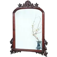 Getoogde mahonie schouwspiegel met gestoken onderhoeken en kroon