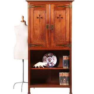 Strakke smalle bijna 2 meter hoge boekenkast met messing en ebbenhout