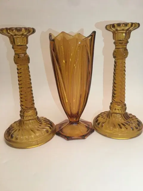 Art Deco - Two pressed glass candlestick and a vase, amber