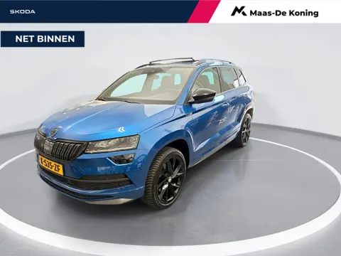 Skoda Karoq 1.5 TSI 150pk DSG Sportline Business · Panoramadak · Camera · Stuur- & Stoelverwarming ·