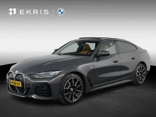 BMW i4 eDrive40 High Executive 84 kWh Dravitgrau met Cognac Volleder | M Sport | Elektrisch Schuif-/