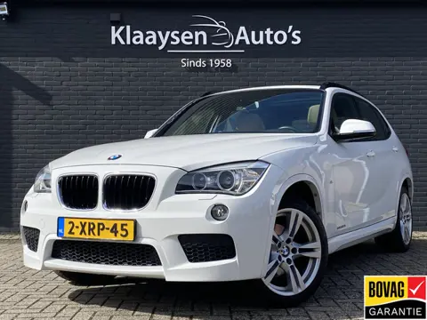 BMW X1 sDrive20i High Executive 184 pk AUT. | panoramadak | navigatie | trekhaak | beige leder inter