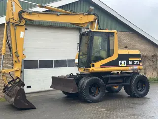 Caterpillar M312 (bj 1997)