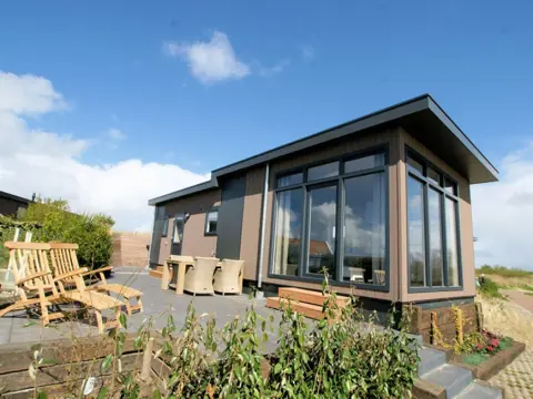Hip chalet met prachtig uitzicht in de duinen bij De Cocksdorp