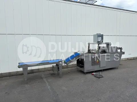 Sorpak Christiaens komkommersealmachine met aanvoerband