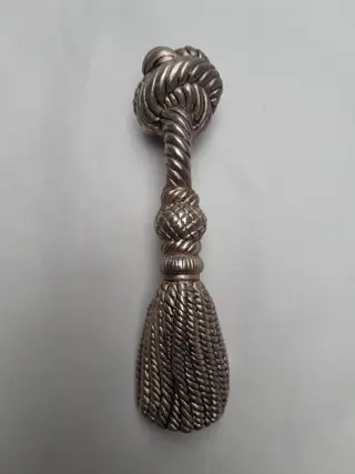Vintage flesopener met touwkwast