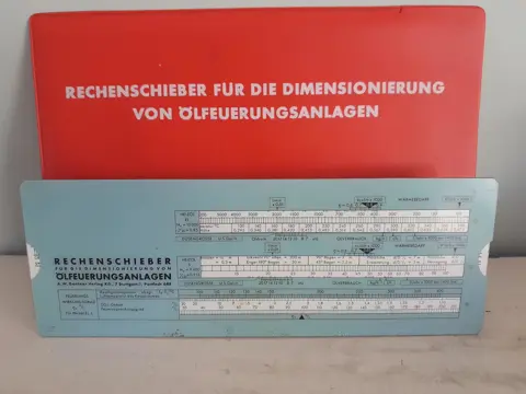 Vintage rekenliniaal voor dimensionierung von Ölfeuerungsanlagen