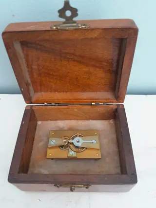 antique clock part in wooden box - clockmaker display