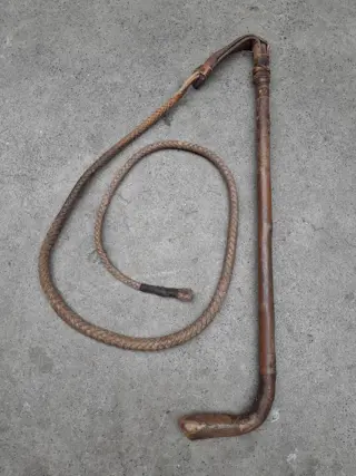 Antique leather hunting whip with wooden handle