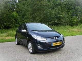 Mazda 2 1.3 TS Plus . 5 Drs . Airco . Stoelverwarming . Navigatie . Elec ramen . enz