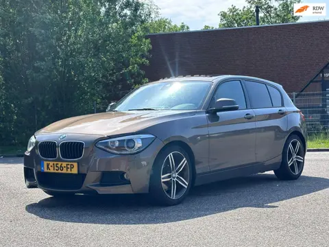 BMW 1-serie 125i Business+ Automaat*Elektrische schuifdak*Dealer onderhouden*Navigatie*Cruise*Airco*