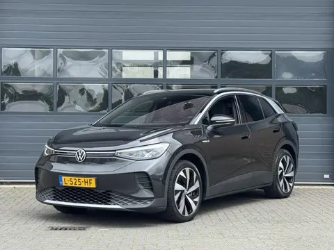 VOLKSWAGEN ID.4 FIRST 77 kWh (SOH 89%) I AUTOMAAT I TREKHAAK I WARMTEPOMP I P-CAMERA I STOELVERWARMI