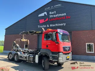 MAN TGS 28.400 6X4-4 BL met 26t Hyva haakarm en Palfinger PK92501 kraan. BS2104