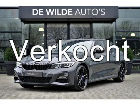 BMW 3-serie 320e M-sport Dravitgrijs Schuifdak Carbon 19-inch Camera Stoelverwarming