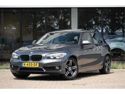 BMW 1-serie 118i | Schuif/Kanteldak | Navi | Trekhaak | Stoelverw. | PDC | Clima | Cruise